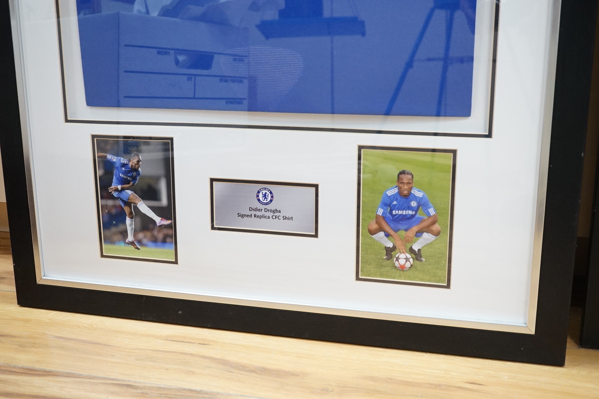 Three signed football shirts, to include England World Cup 2006 and Didier Drogba signed replica CFC shirt, framed. Condition - good